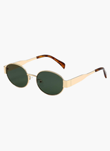 Montura dorada, lentes verdes
